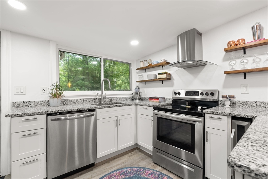 47 South Shore Road Holbrook, MA 02343 - Photo 10 of 30 a kitchen with stainless steel appliances granite countertop a stove and a sink
