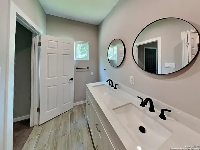 a bathroom with a sink and a mirror