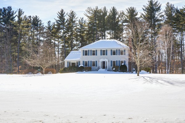 88 Mason Road Townsend, MA 01474 - Photo 1 of 30 a white house with a large tree in front of it