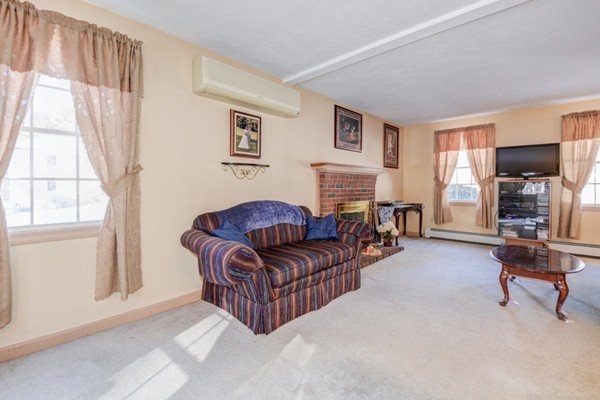 88 Mason Road Townsend, MA 01474 - Photo 11 of 30 a living room with furniture and a fireplace