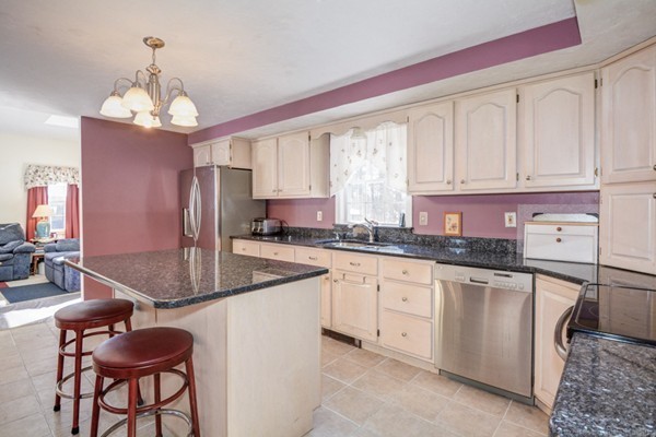 88 Mason Road Townsend, MA 01474 - Photo 16 of 30 a kitchen with granite countertop a sink stainless steel appliances and cabinets
