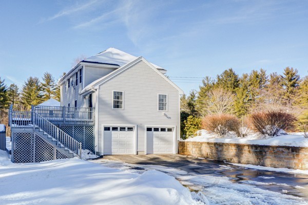 88 Mason Road Townsend, MA 01474 - Photo 4 of 30 a view of house with river and trees in the background