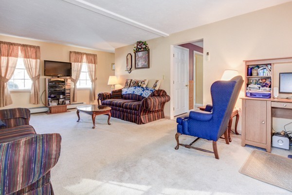 88 Mason Road Townsend, MA 01474 - Photo 10 of 30 a living room with furniture and a flat screen tv
