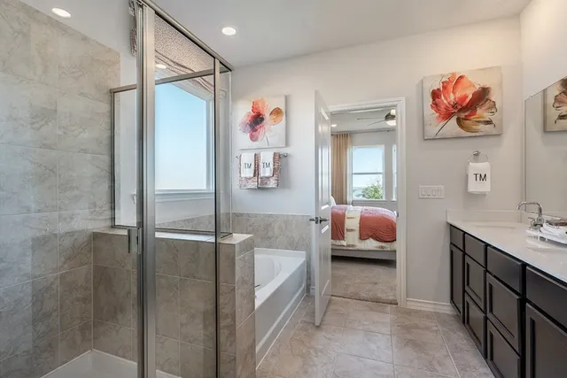 a spacious bathroom with a tub and a shower