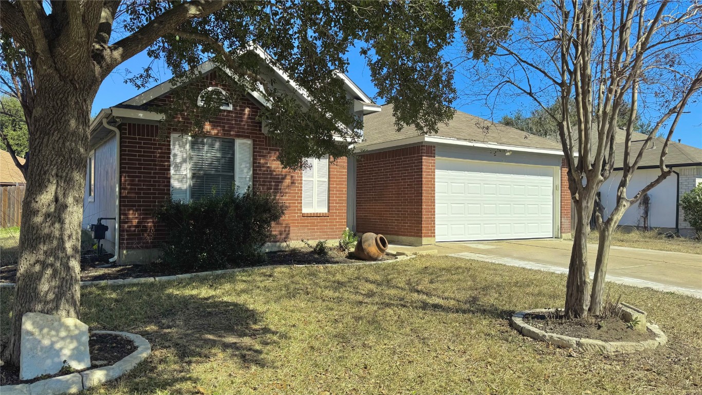 104 Evergreen Circle Georgetown, TX 78626 - Photo 1 of 1 a front view of a house with garden