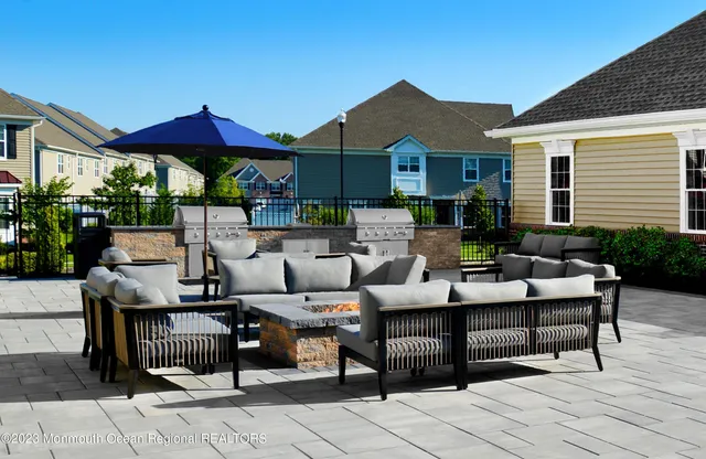 a outdoor space with patio couches and a potted plant