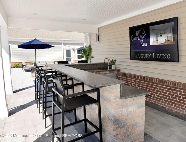 a view of a dinning table and chairs in the patio