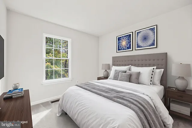 a bedroom with bed and a window