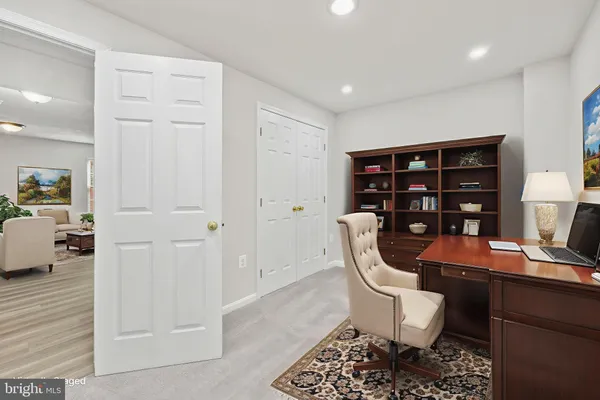 a view of a workspace with furniture