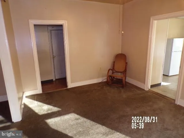 a view of a room with furniture and a rug
