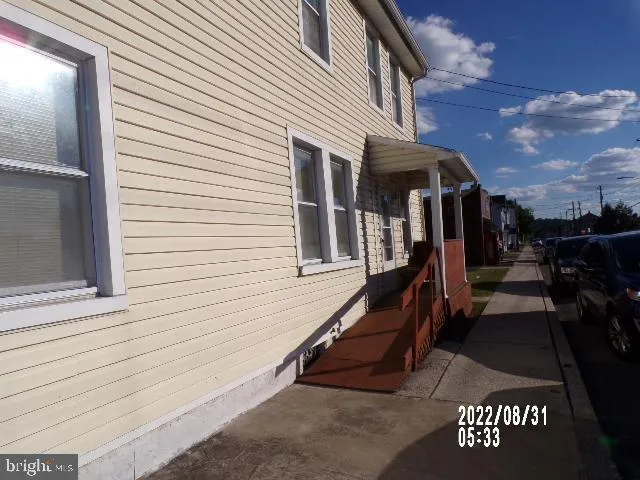 a view of a house with a door and porch
