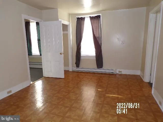 a view of an empty room and window