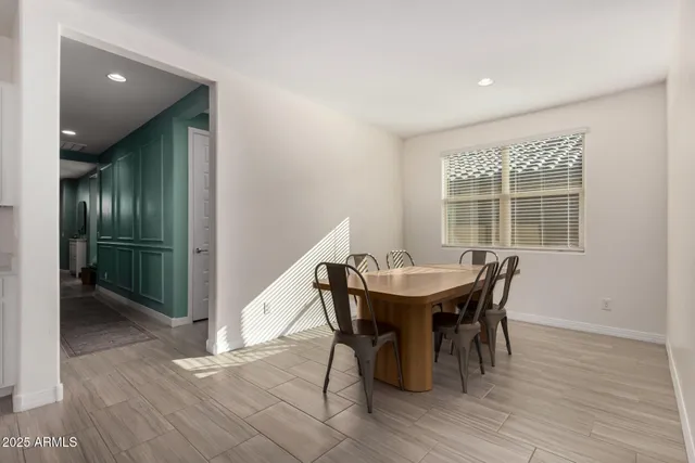 a view of a dining room with furniture and window