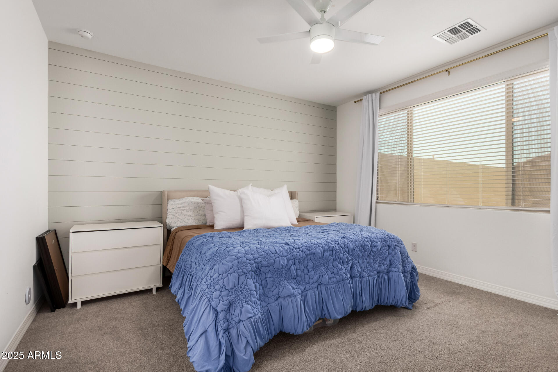 2652 South Prospector Point Road Apache Junction, AZ 85119 - Photo 17 of 37 a bedroom with a bed and a large window