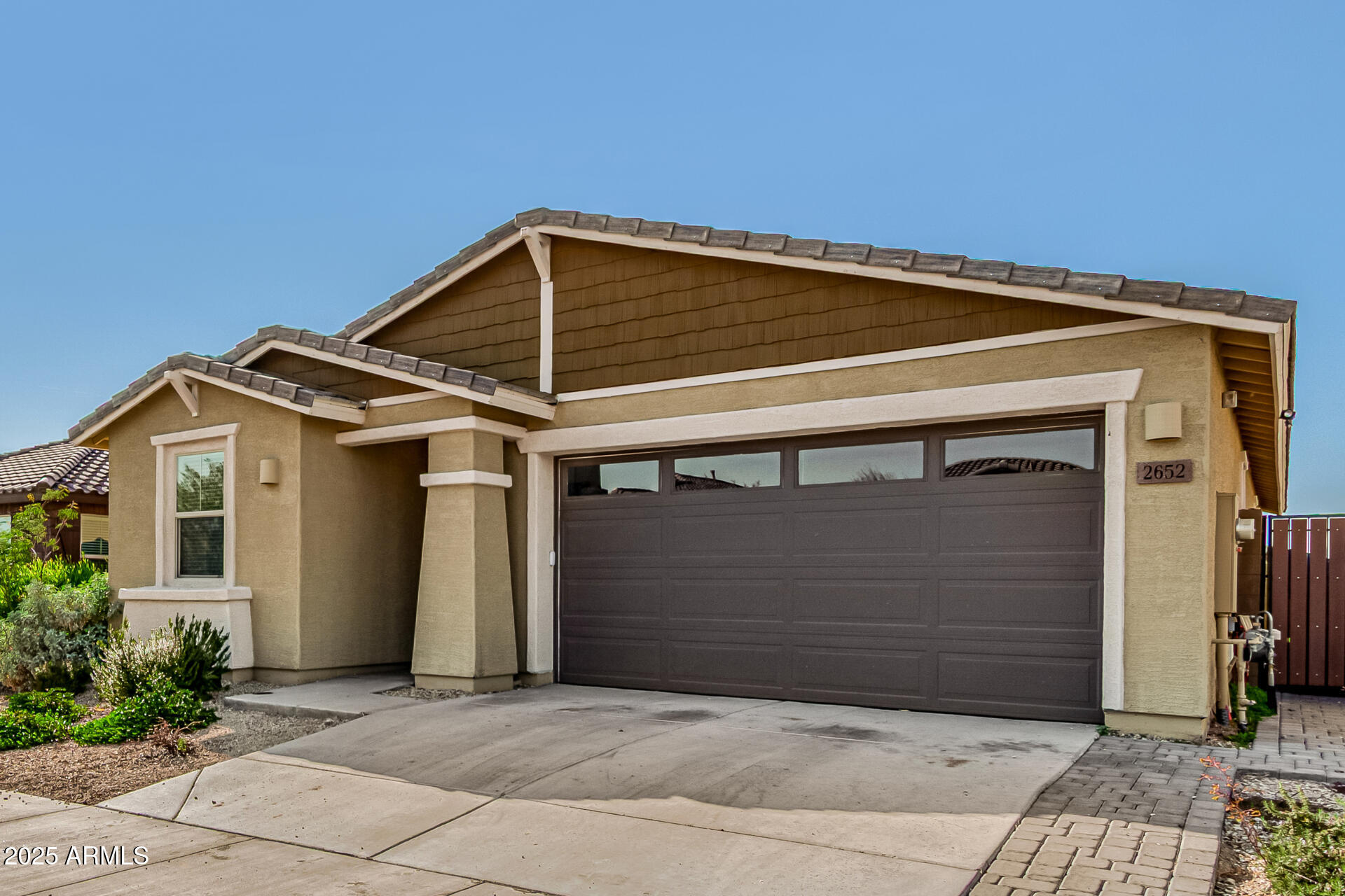 2652 South Prospector Point Road Apache Junction, AZ 85119 - Photo 2 of 37 a front view of a house with garage