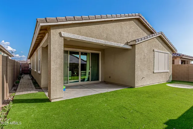 a backyard of a house with lots of green space