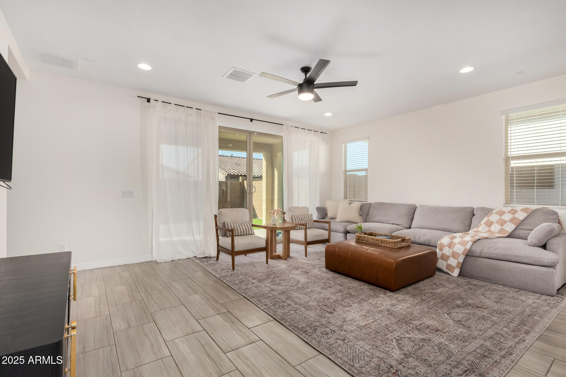 2652 South Prospector Point Road Apache Junction, AZ 85119 - Photo 6 of 37 a living room with furniture and a large window
