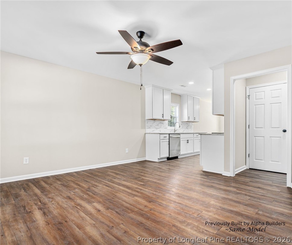 973 Martin Road St. Pauls, NC 28384 - Photo 11 of 19 Open and inviting living room filled with natural light and prewired for a built-in 5.1 surround sound system. Perfect for entertaining or immersive movie nights.