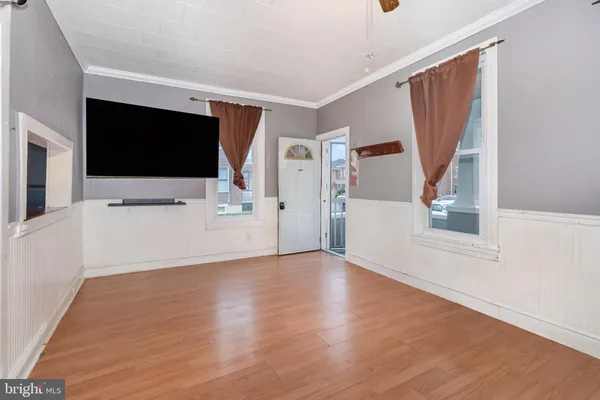 a view of a living room with flat screen tv