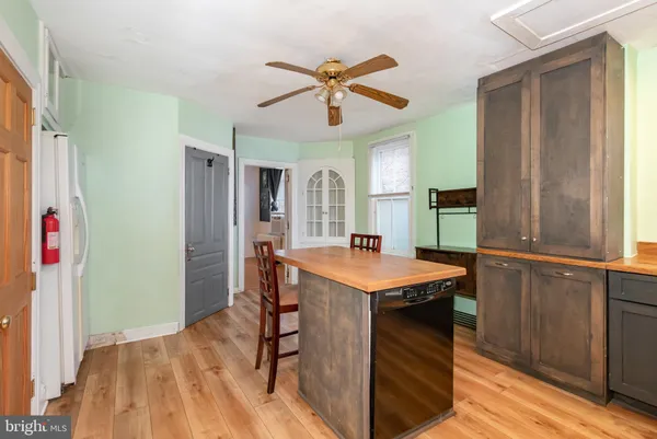 a view of a kitchen with a table and chairs
