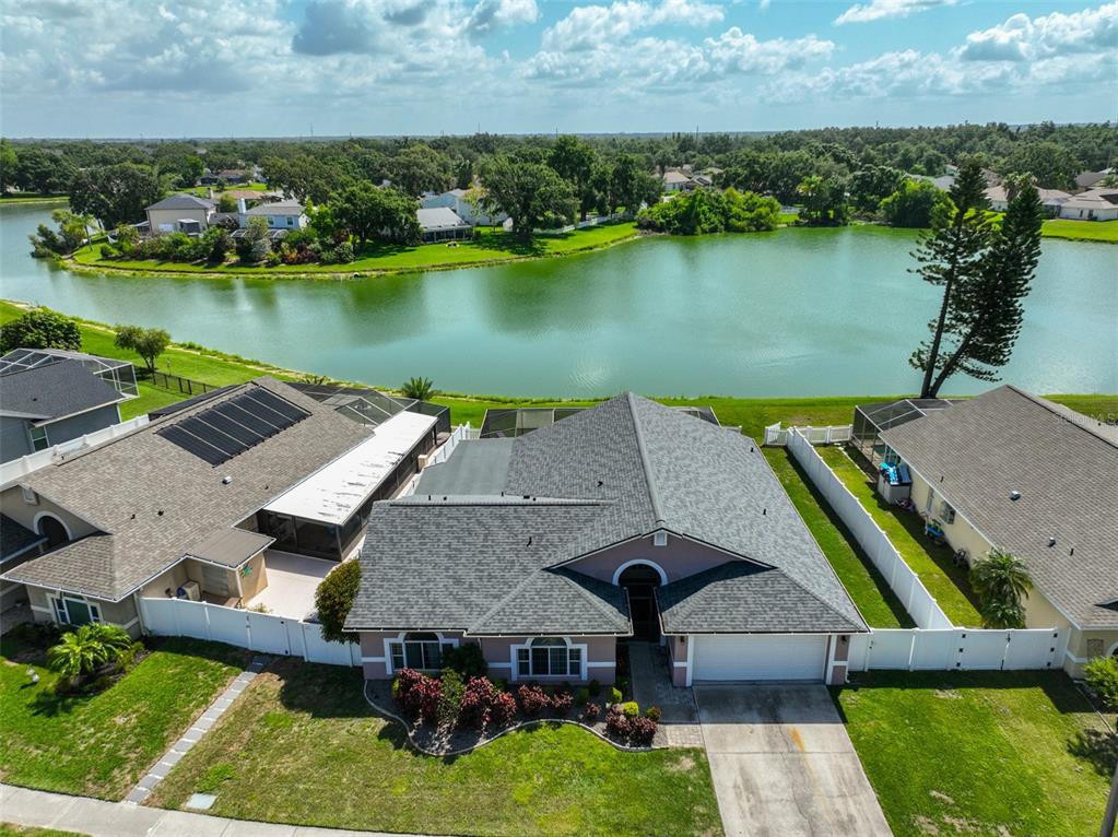 an aerial view of a house with a lake view
