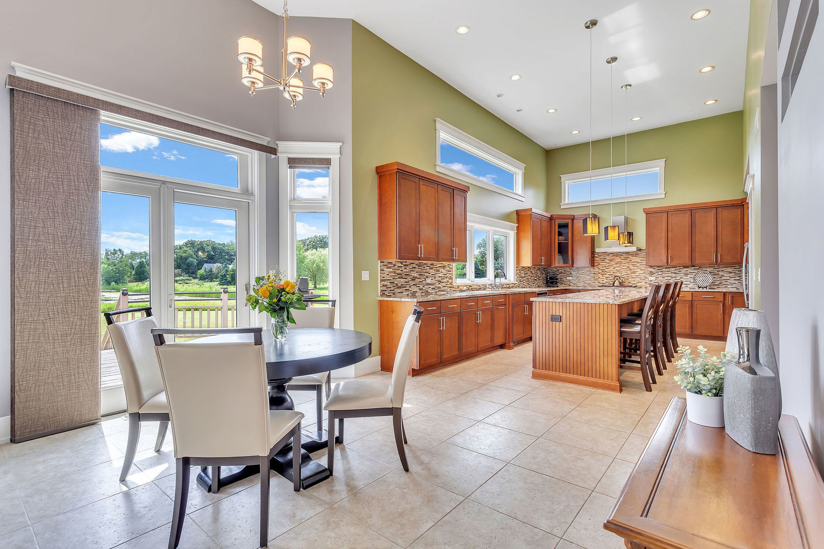 40 Stonecrest Drive Elgin, IL 60124 - Photo 12 of 63 a kitchen with a table chairs refrigerator and cabinets