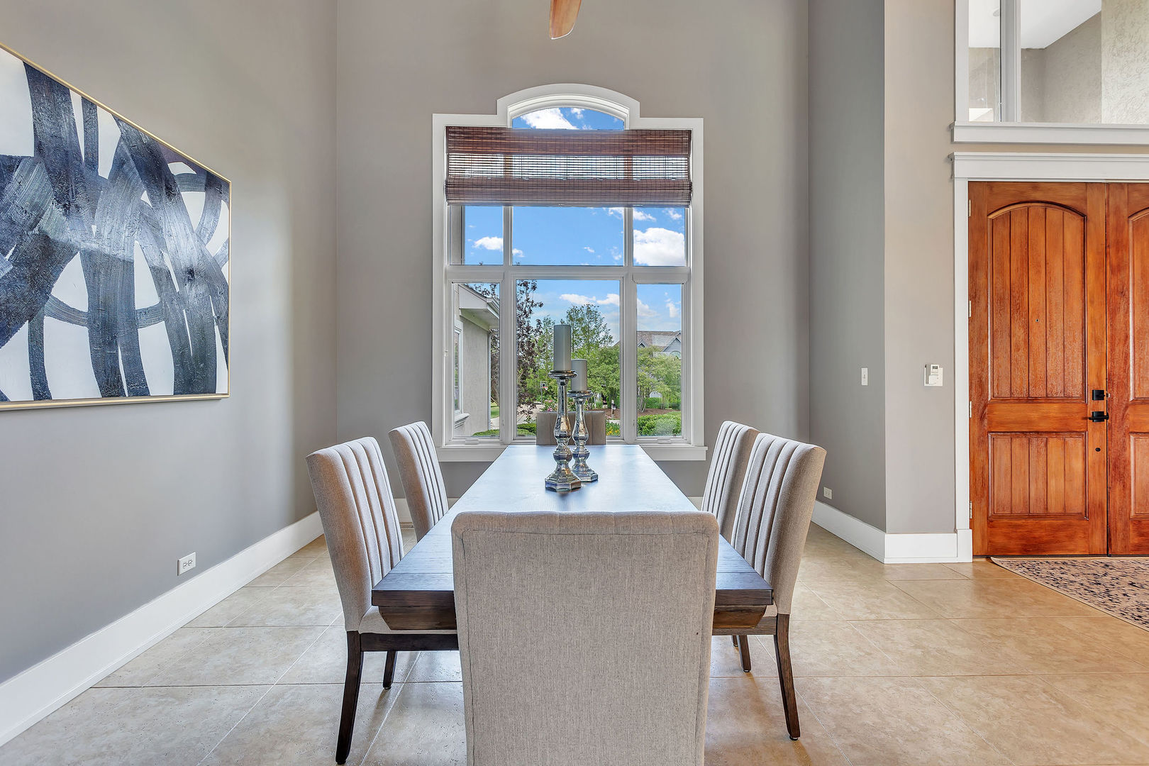 40 Stonecrest Drive Elgin, IL 60124 - Photo 19 of 63 a dining room with furniture a potted plant and a chandelier