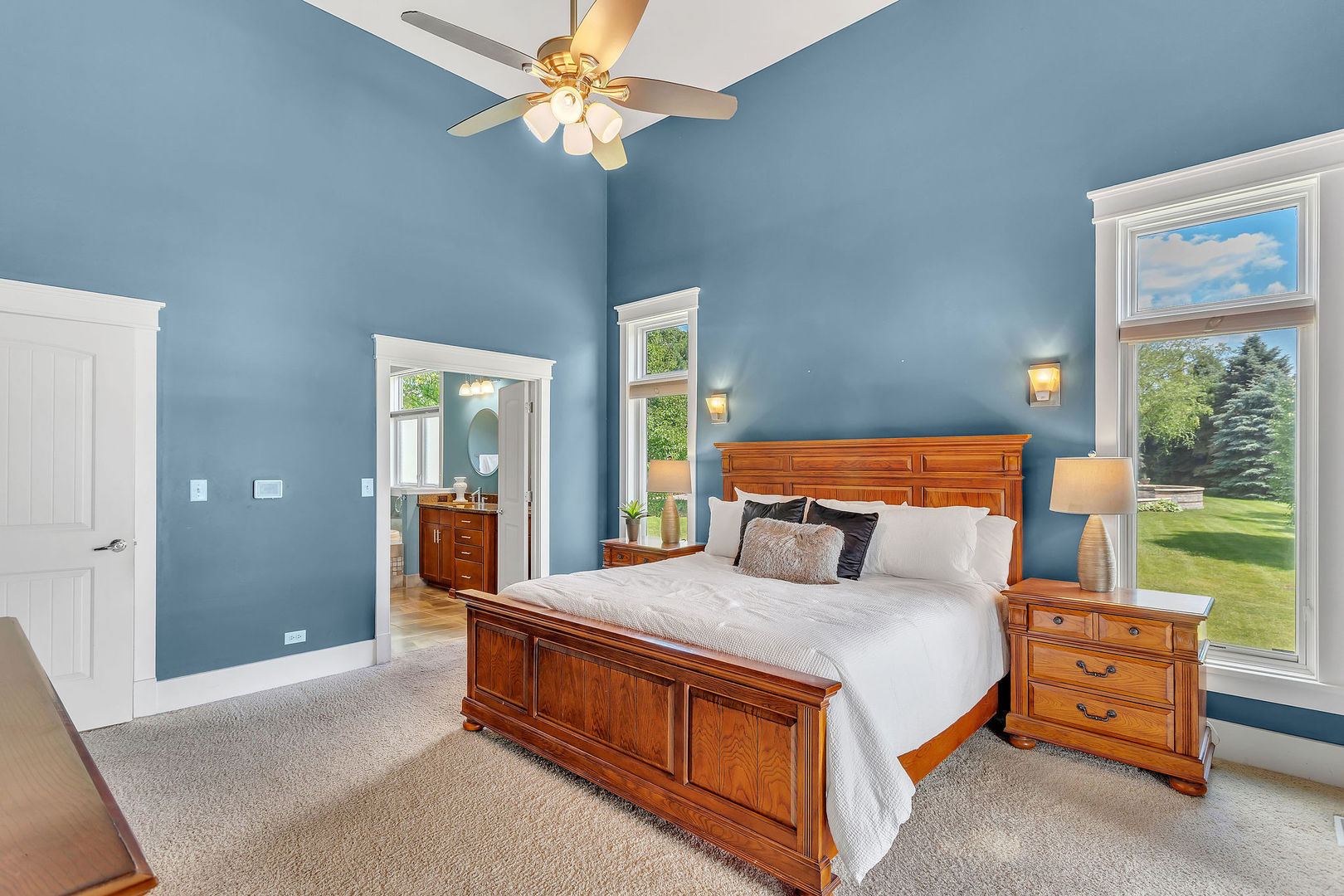 40 Stonecrest Drive Elgin, IL 60124 - Photo 21 of 63 a bedroom with a large bed and a chandelier