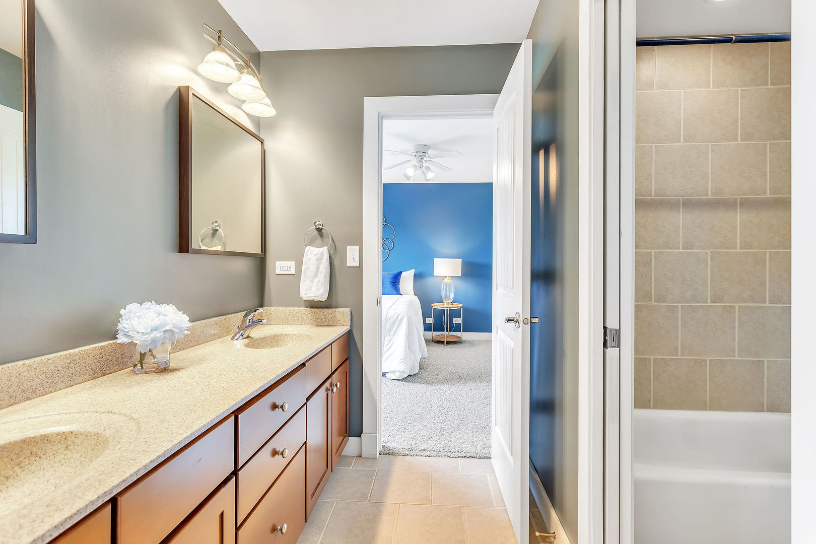 40 Stonecrest Drive Elgin, IL 60124 - Photo 38 of 63 a en suite bathroom with a double vanity sink and a mirror
