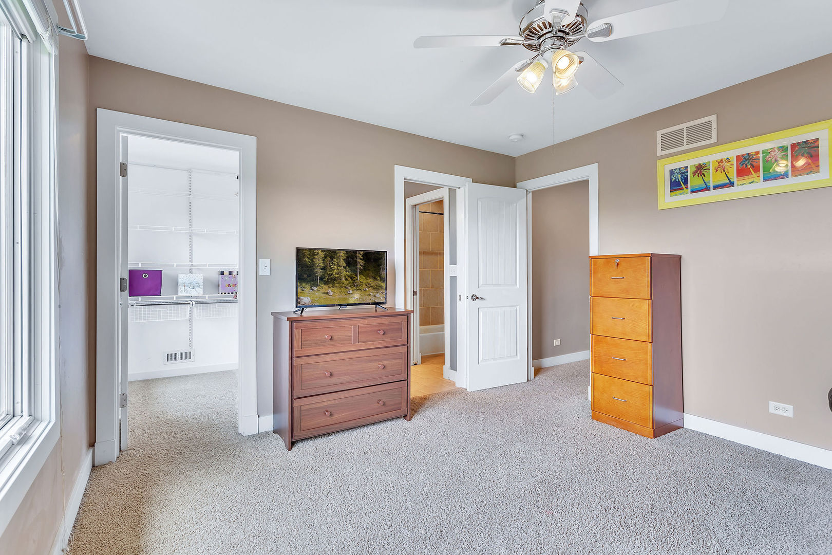 40 Stonecrest Drive Elgin, IL 60124 - Photo 41 of 63 a room with window and a dresser