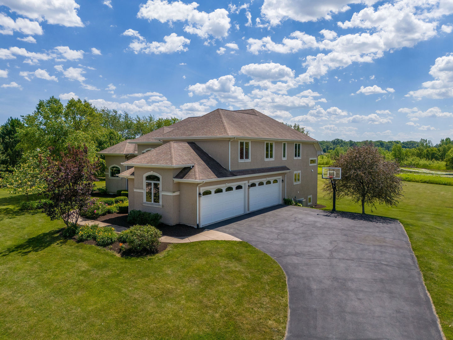40 Stonecrest Drive Elgin, IL 60124 - Photo 5 of 63 a view of a house with a big yard plants and large tree