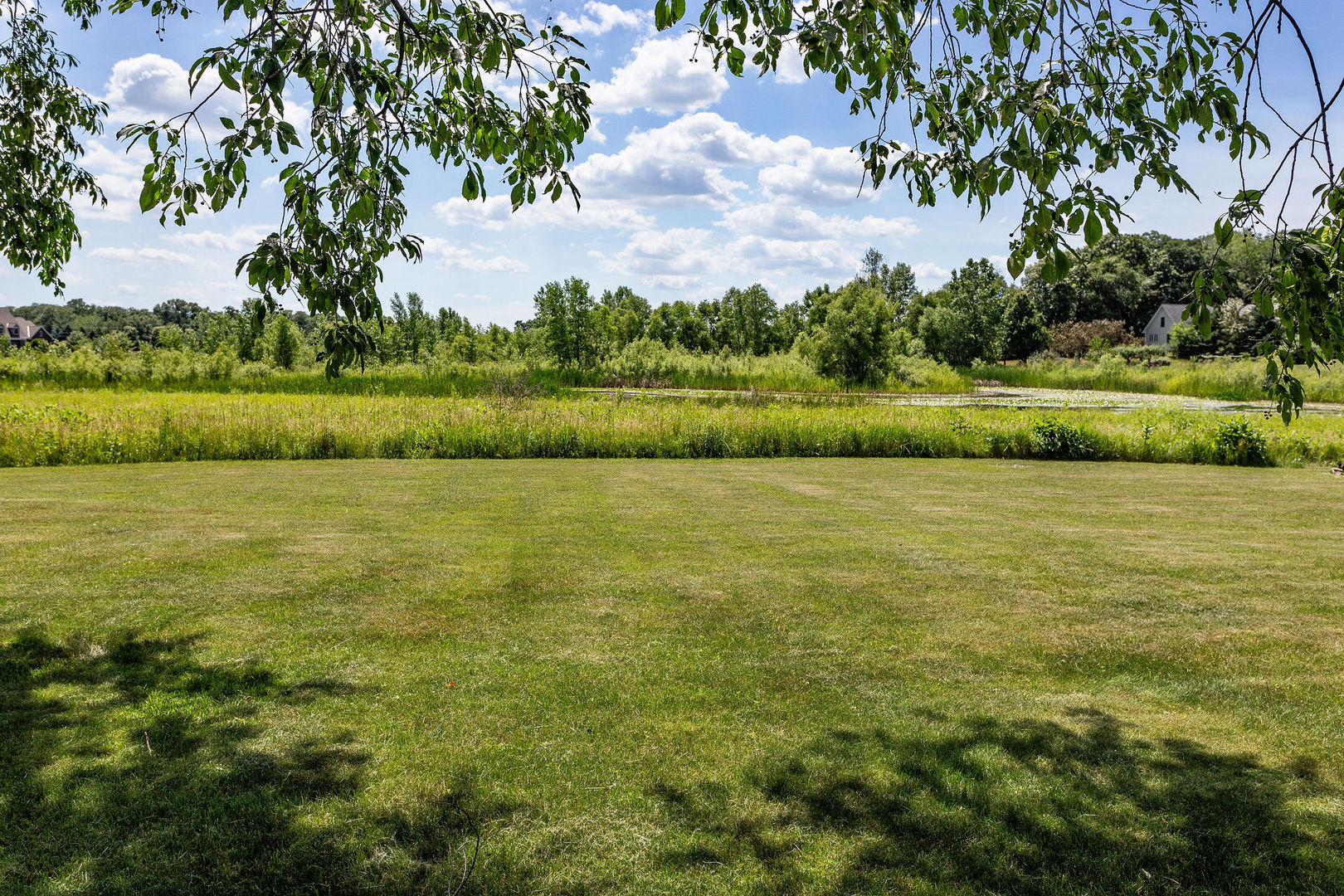 40 Stonecrest Drive Elgin, IL 60124 - Photo 54 of 63 a view of a lake with houses in the back
