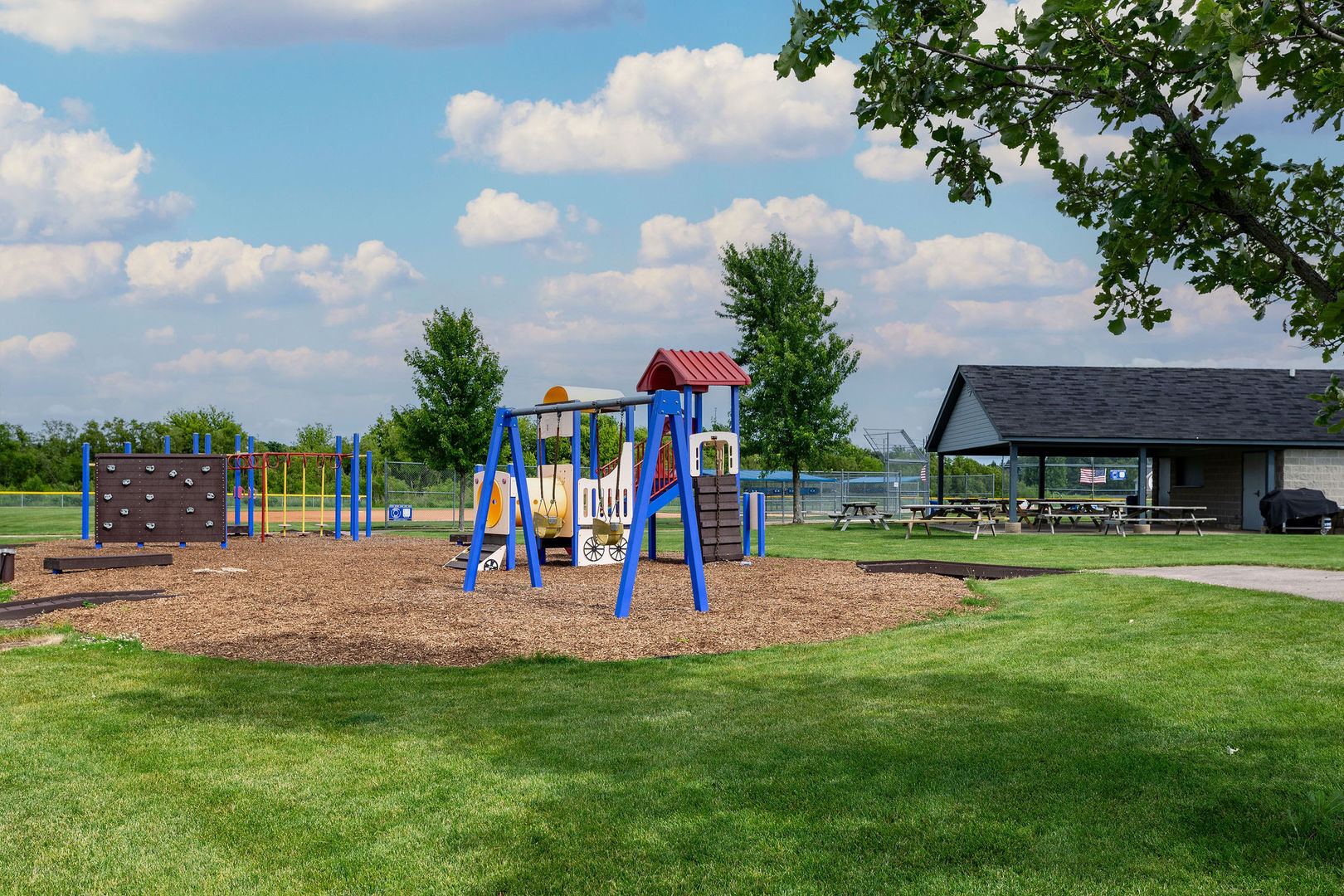 40 Stonecrest Drive Elgin, IL 60124 - Photo 58 of 63 a view of a park with swings and slides