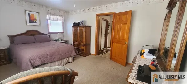 a bedroom with a bed and a closet