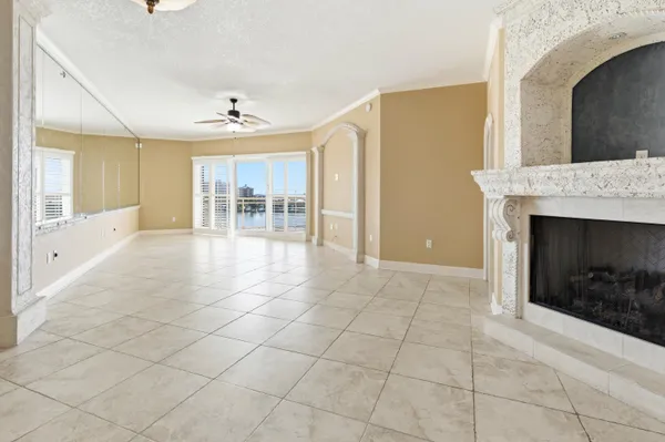 a view of a hallway with a dining table chairs and couches