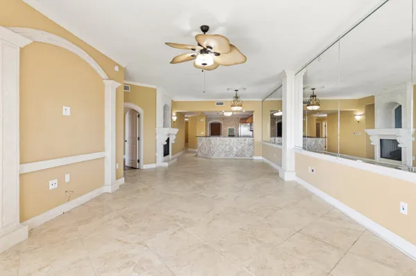 a kitchen with stainless steel appliances granite countertop a sink a stove and a refrigerator
