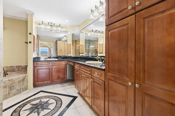 a bathroom with a sink double vanity and a mirror