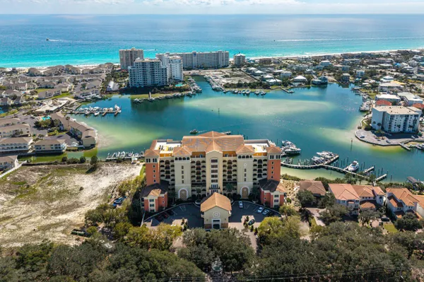 an aerial view of a city with ocean view
