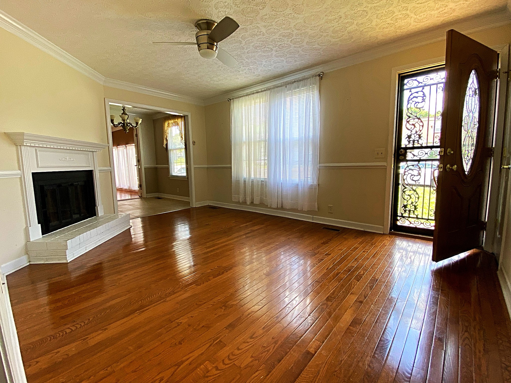 1605 Autumn Ridge Drive Nashville, TN 37207 - Photo 7 of 21 a view of a livingroom with wooden floor a fireplace and windows