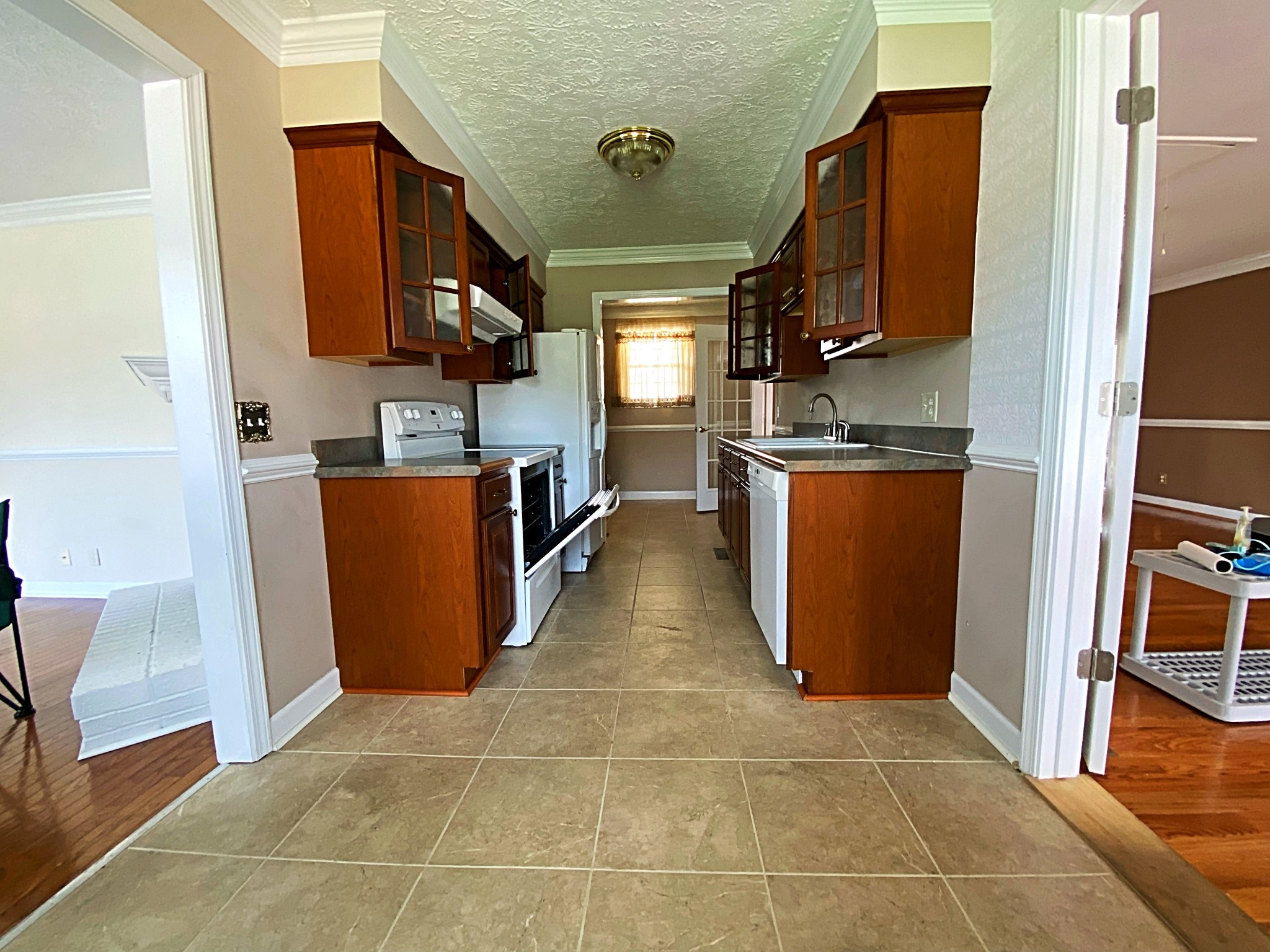 1605 Autumn Ridge Drive Nashville, TN 37207 - Photo 10 of 21 a view of a kitchen with fridge and workspace