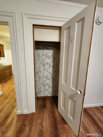 a view of front door with wooden floor