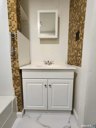 a close view of a sink and a mirror