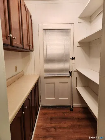 a kitchen with a sink a stove and cabinets