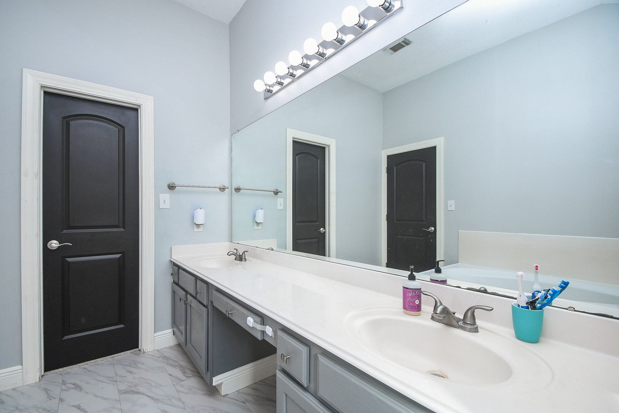 10823 Windswept Montgomery, TX 77356 - Photo 19 of 32 a bathroom with a sink double vanity and a mirror