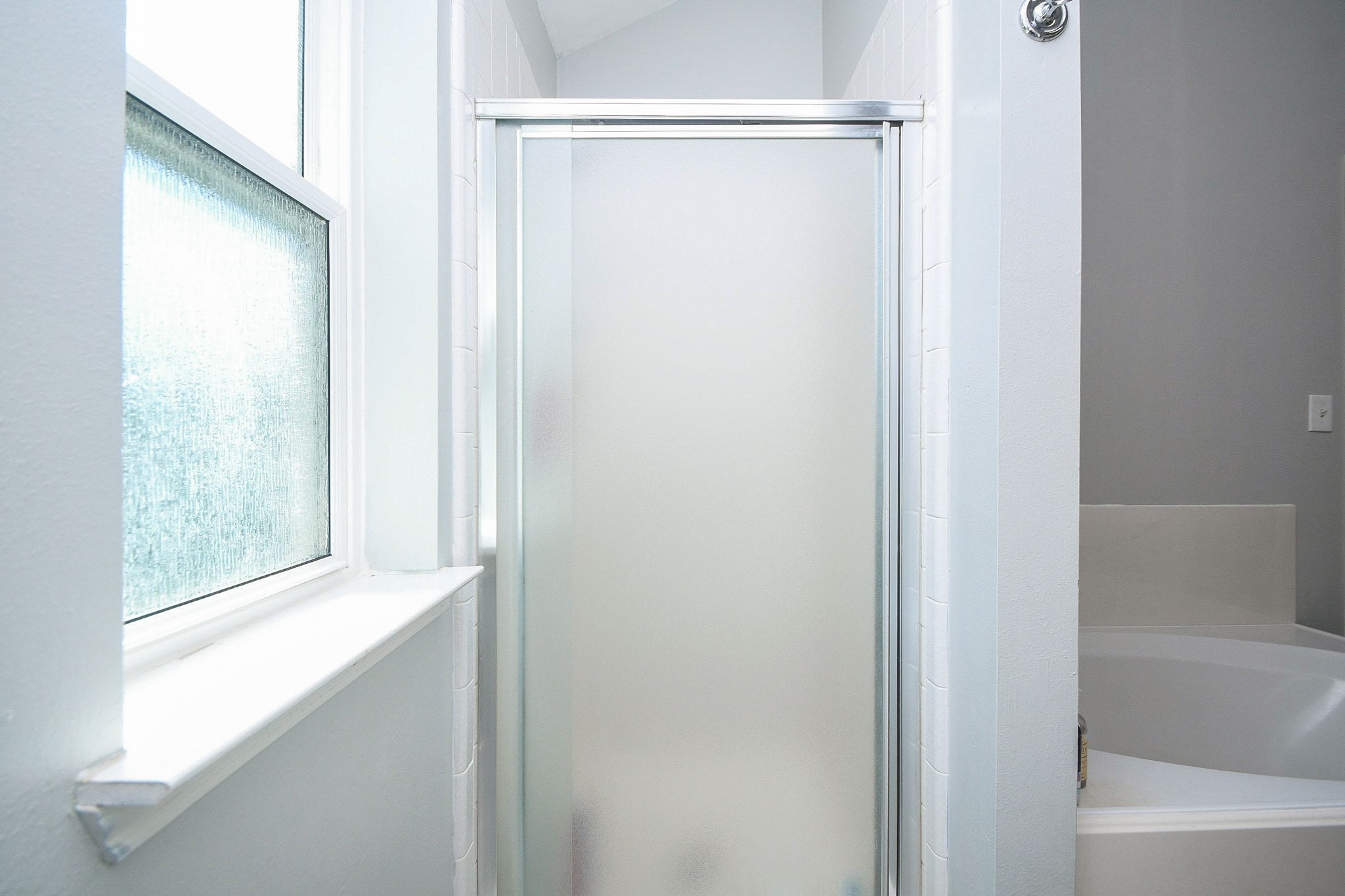 10823 Windswept Montgomery, TX 77356 - Photo 21 of 32 a bathroom with a glass shower door