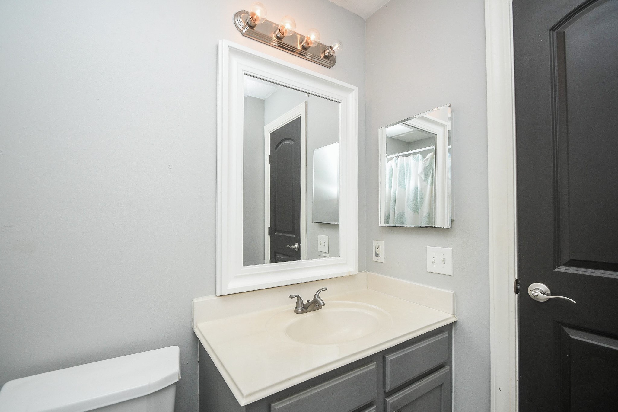 10823 Windswept Montgomery, TX 77356 - Photo 29 of 32 a bathroom with a sink vanity and toilet