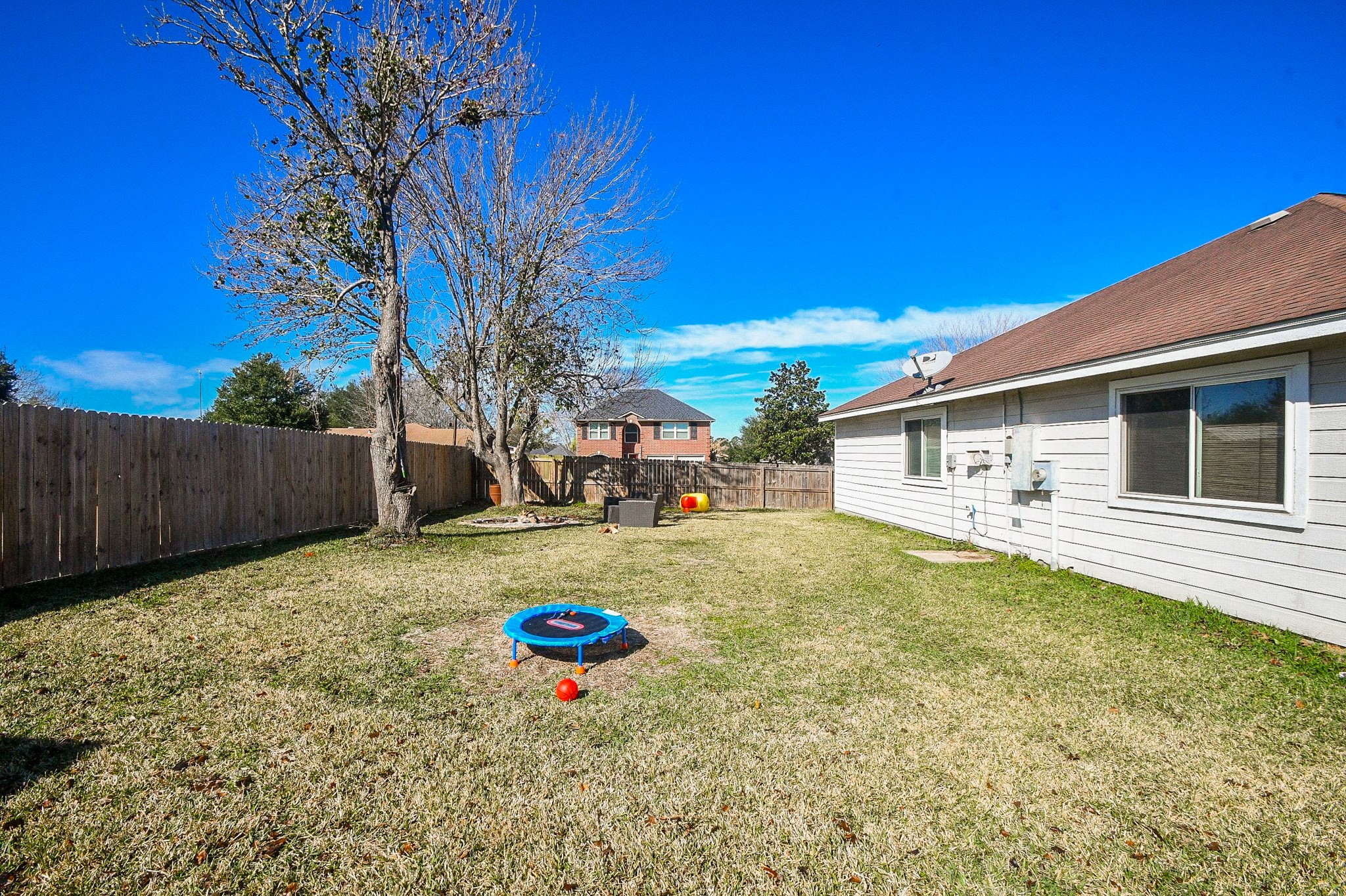 10823 Windswept Montgomery, TX 77356 - Photo 30 of 32 a view of a backyard with a large tree