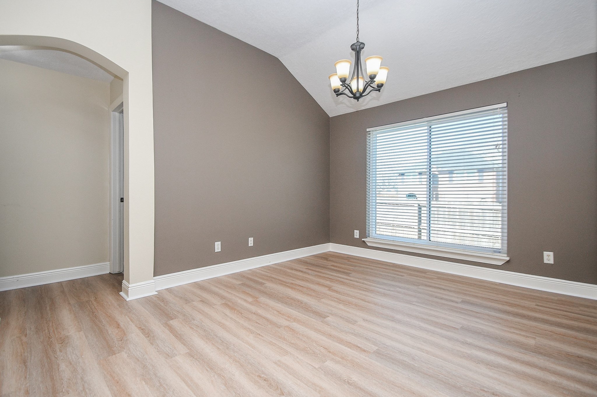 10823 Windswept Montgomery, TX 77356 - Photo 3 of 32 a view of an empty room with wooden floor and a window