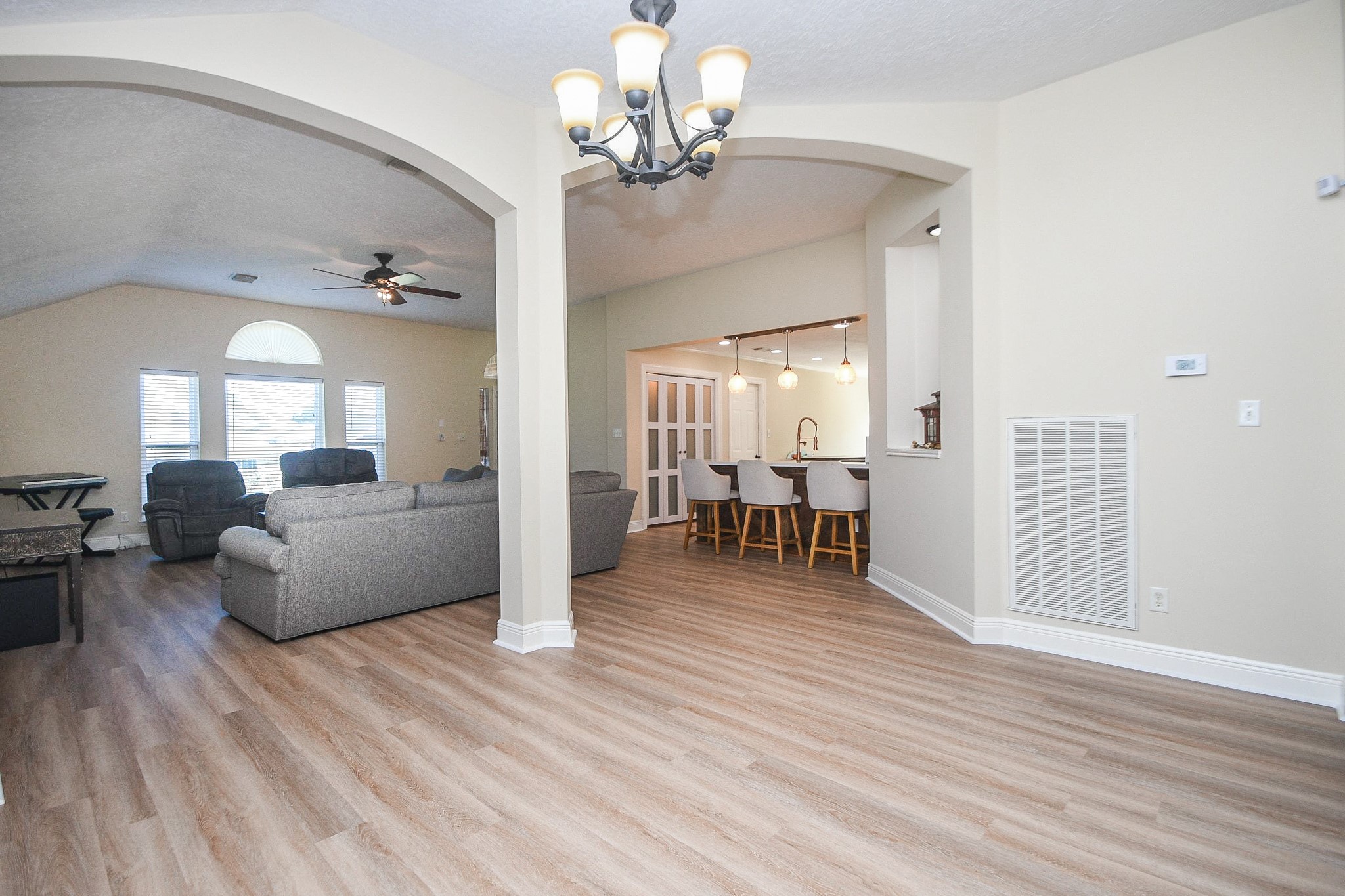 10823 Windswept Montgomery, TX 77356 - Photo 5 of 32 a view of a livingroom with a furniture wooden floor and a chandelier