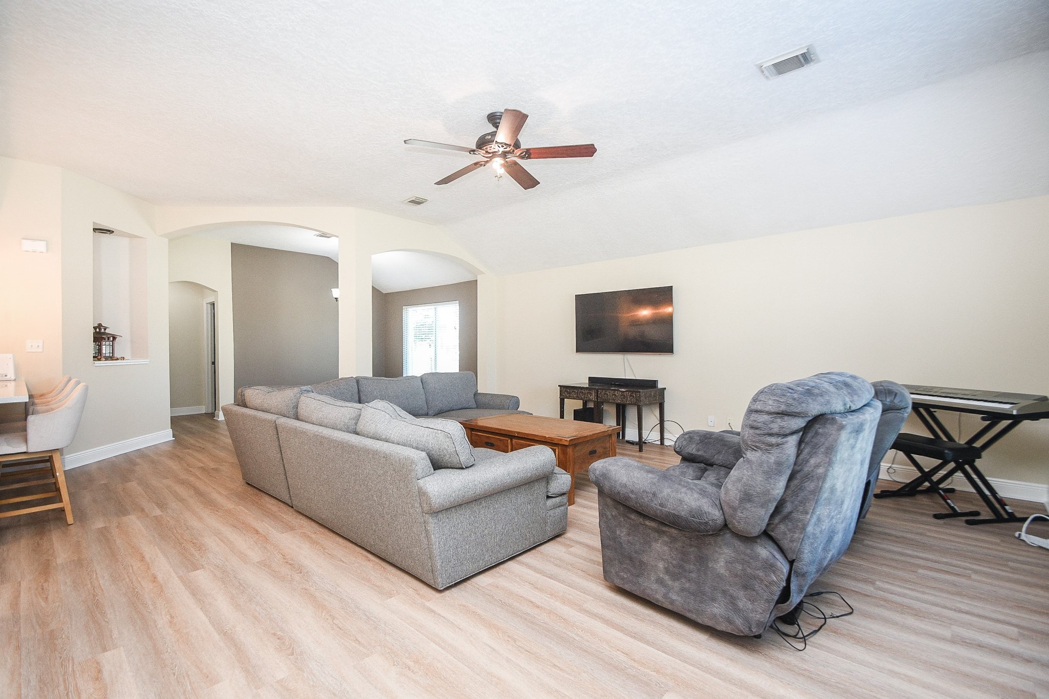 10823 Windswept Montgomery, TX 77356 - Photo 6 of 32 a living room with furniture and a flat screen tv